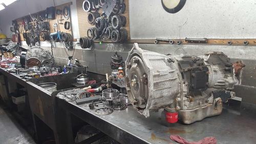 Transmission parts laid out on a workbench